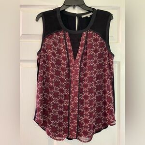 Silky sleeveless top in the front, solid black in the back
